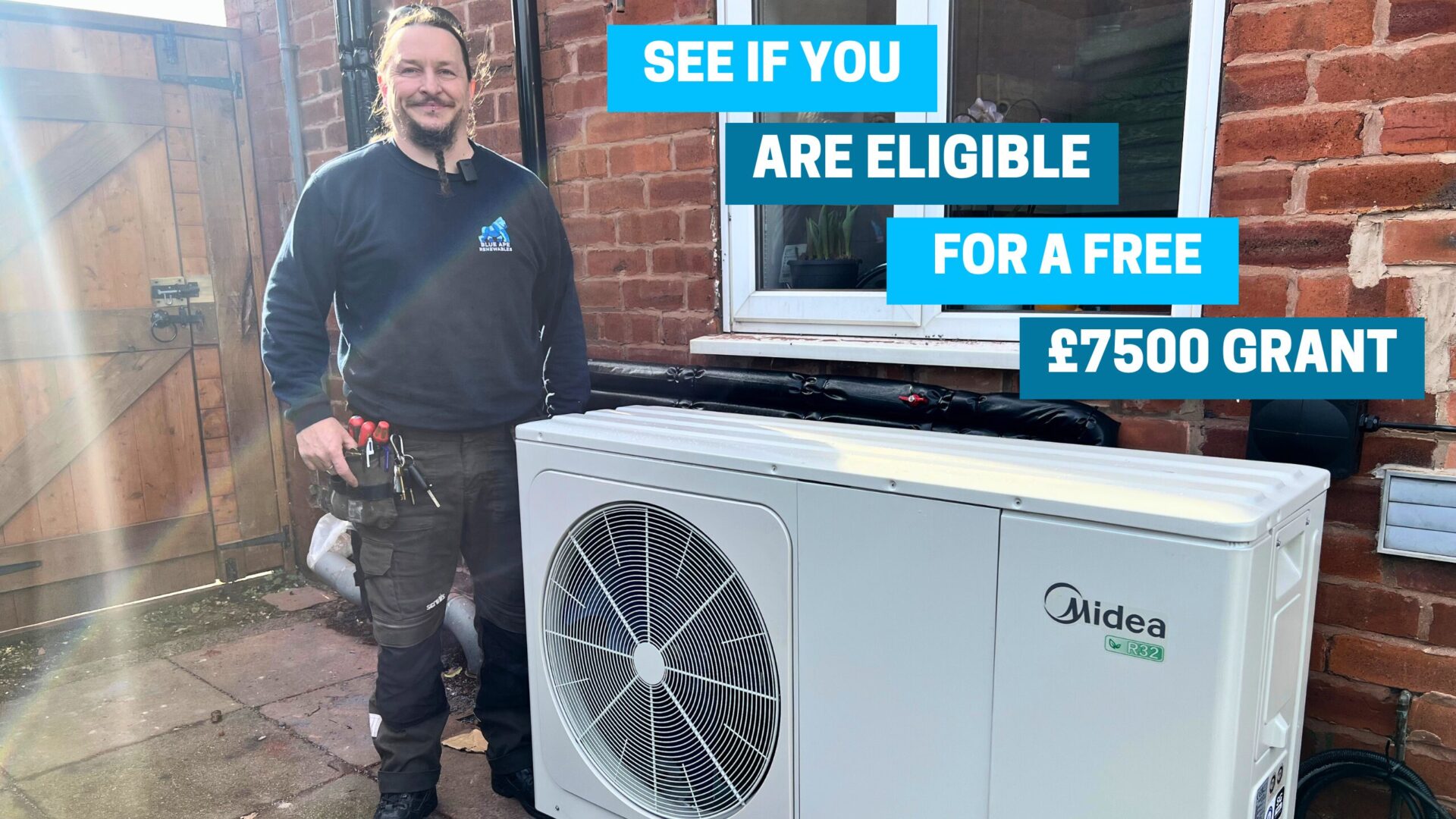 Air source heat pump installed on a UK home with £7,500 grant text