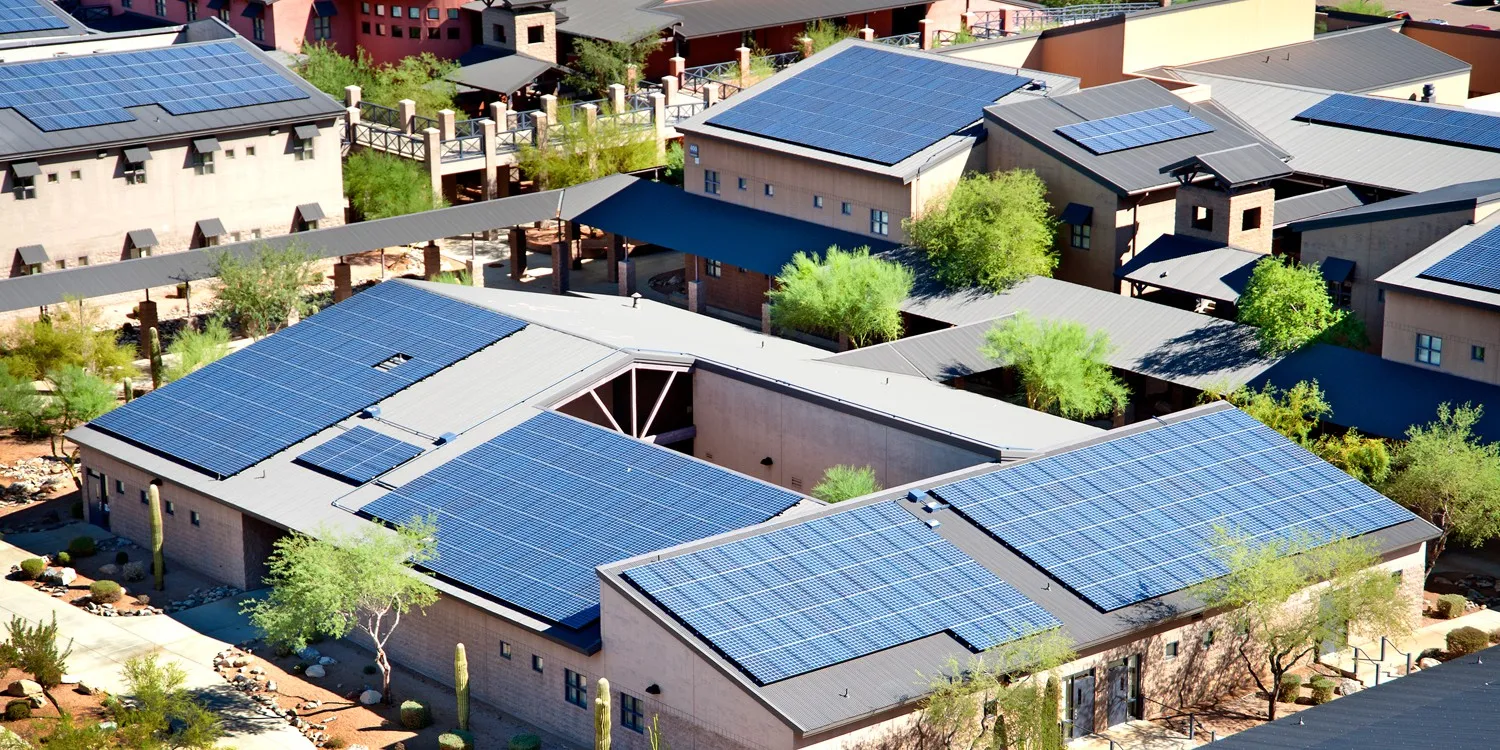 Solar panels installed on a UK school roof reducing energy costs