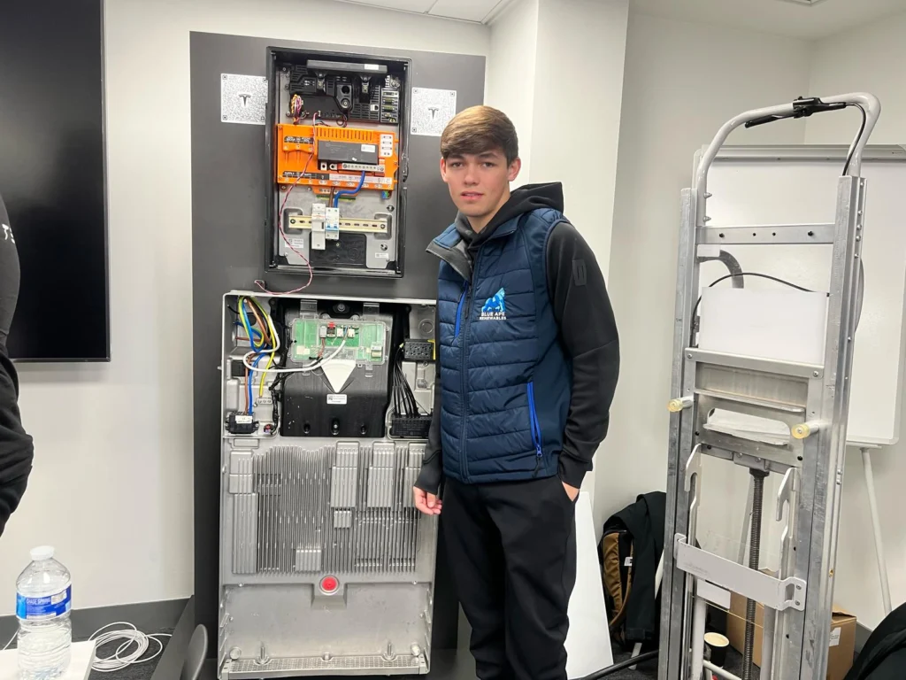 Blue Ape Renewables engineer training on Tesla Powerwall 3 internal components